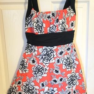 Coral dress with black and white floral design